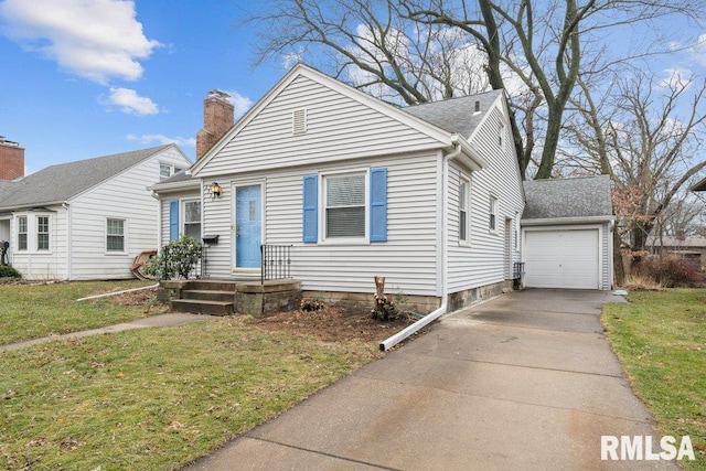 view of front of house featuring a front yard and a garage