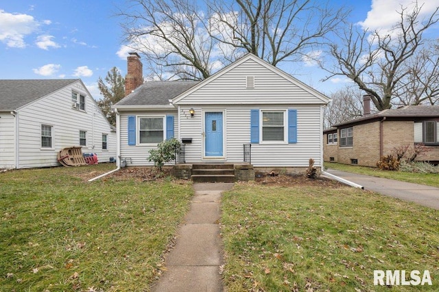 bungalow-style house with a front lawn