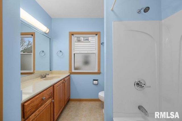 full bathroom featuring tile patterned floors, vanity, toilet, and  shower combination