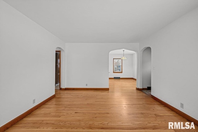 unfurnished room featuring light hardwood / wood-style flooring