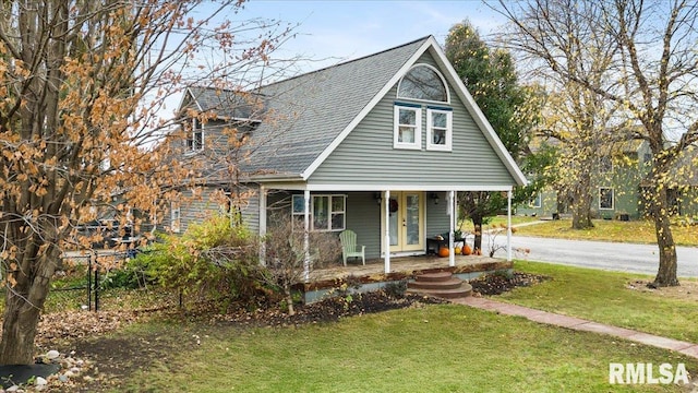 view of front of home featuring covered porch and a front lawn