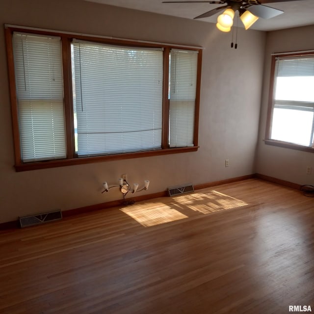 unfurnished room with light hardwood / wood-style flooring and ceiling fan