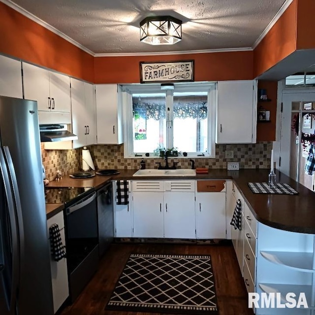 kitchen featuring dark hardwood / wood-style floors, white cabinetry, and appliances with stainless steel finishes