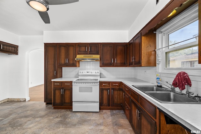 kitchen with sink, tasteful backsplash, white electric range, and ceiling fan