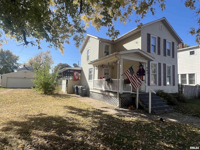 443 4th Ave N, Clinton, IA 52732 - view of front of property with a porch, a garage, and an outdoor structure
