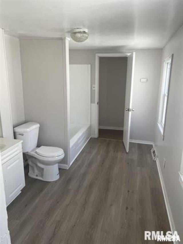 443 4th Ave N, Clinton, IA 52732 - bathroom with vanity, wood finished floors, and bathtub / shower combination