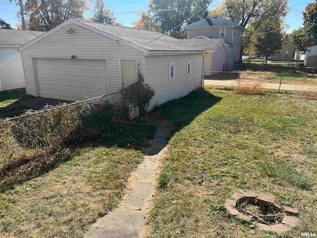 garage featuring a lawn