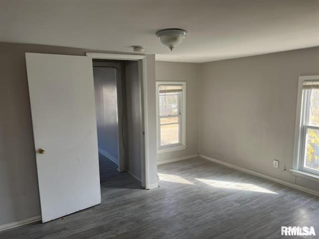 443 4th Ave N, Clinton, IA 52732 - spare room featuring healthy amount of natural light, wood finished floors, and a smoke detector