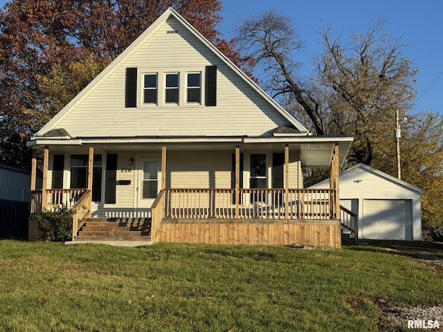 farmhouse inspired home featuring an outbuilding, a garage, covered porch, and a front lawn