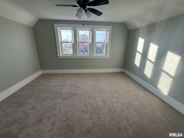 bonus room with carpet floors, ceiling fan, and vaulted ceiling