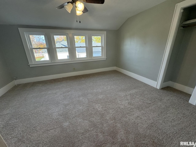 interior space with a wealth of natural light, lofted ceiling, and ceiling fan