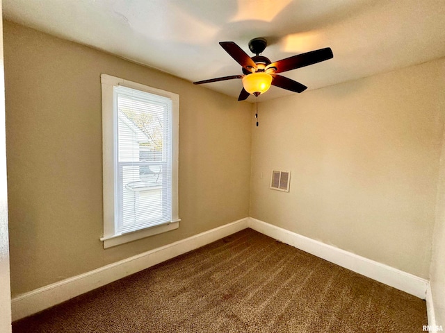 empty room featuring ceiling fan and carpet floors