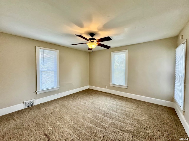 empty room with carpet and ceiling fan