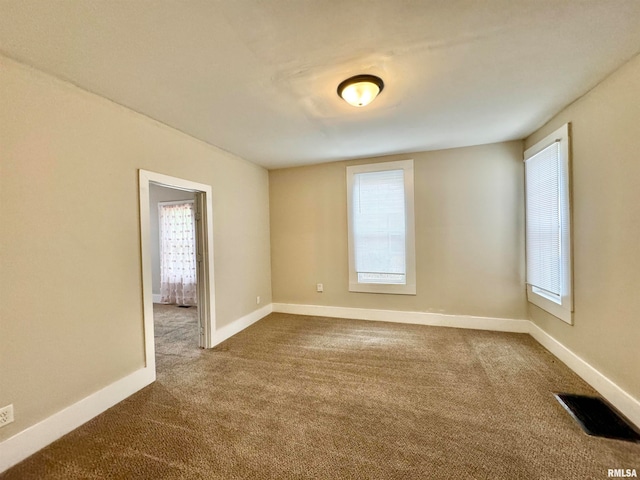 view of carpeted spare room