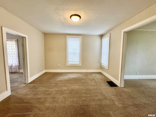 unfurnished room with carpet floors