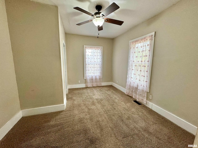 carpeted empty room with ceiling fan