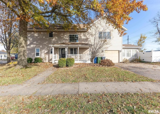 view of front of property featuring a garage and covered porch