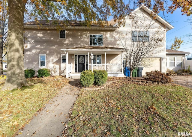 view of front facade featuring covered porch and a front yard