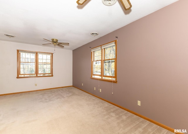 carpeted empty room with ceiling fan