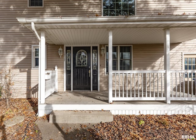 doorway to property with a porch