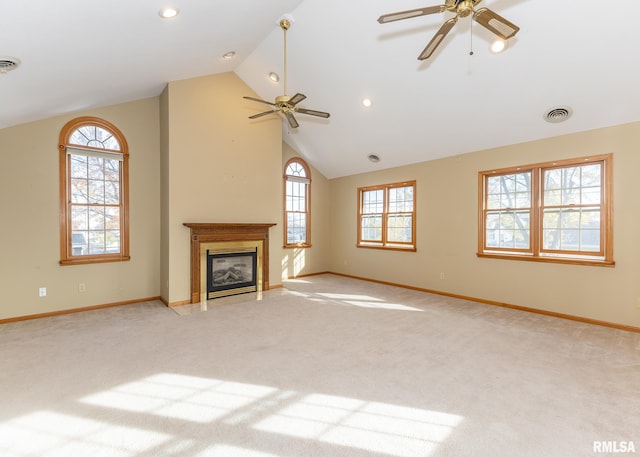 unfurnished living room with light carpet, ceiling fan, and vaulted ceiling