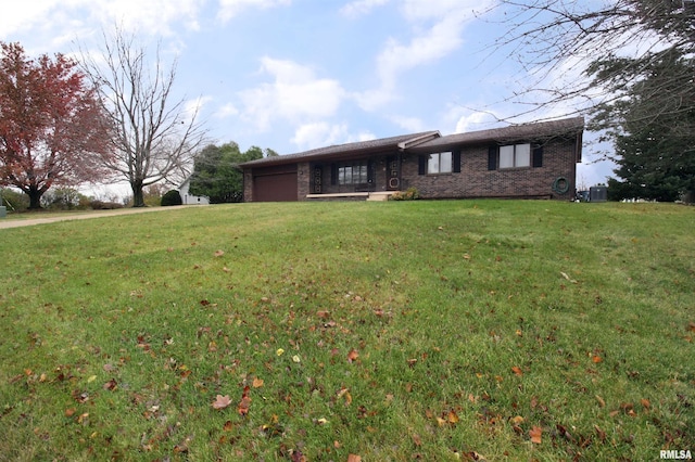 ranch-style house with a front lawn and central AC