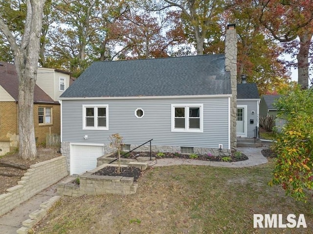 cape cod-style house featuring a garage