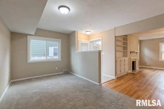 unfurnished room with light hardwood / wood-style floors