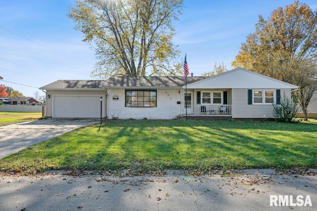 ranch-style home featuring a garage, a front lawn, and covered porch