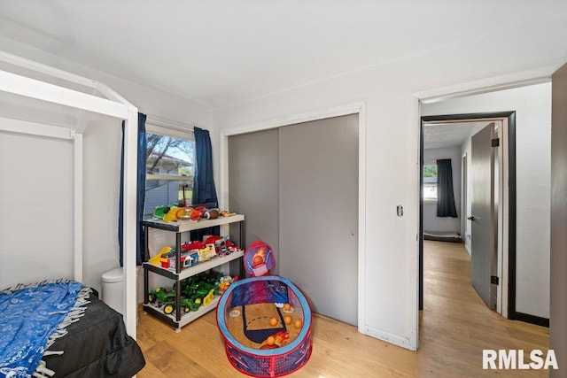 bedroom featuring light wood-type flooring