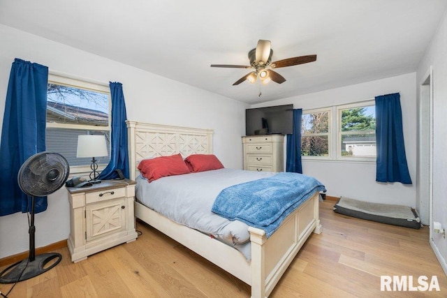 bedroom featuring light hardwood / wood-style floors and ceiling fan