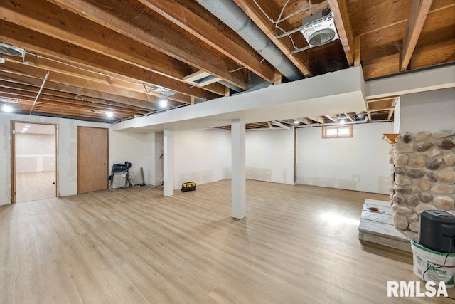 basement featuring light wood-type flooring