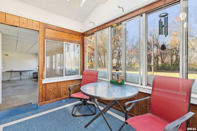 sunroom / solarium featuring vaulted ceiling