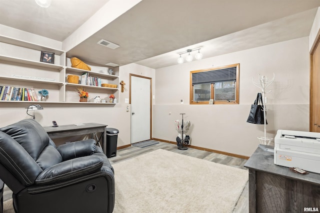 living area with light hardwood / wood-style floors