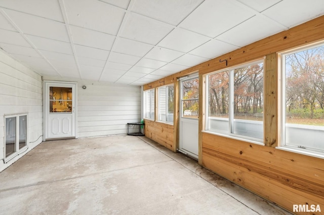 unfurnished sunroom with a paneled ceiling