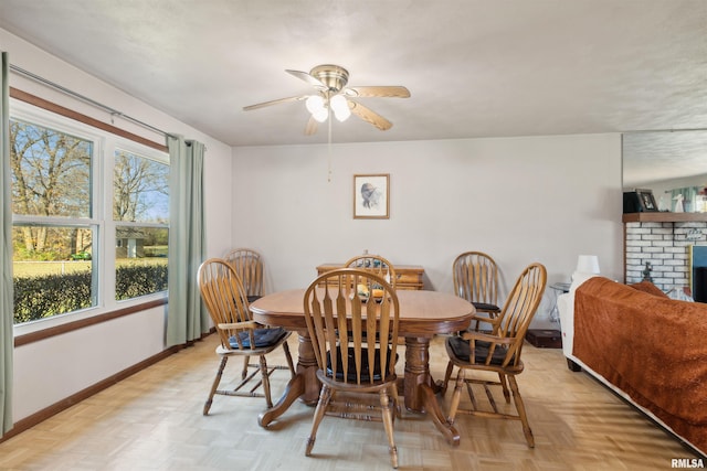 dining area featuring plenty of natural light, ceiling fan, and light parquet floors