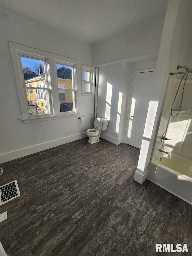 bathroom featuring bathtub / shower combination and hardwood / wood-style floors