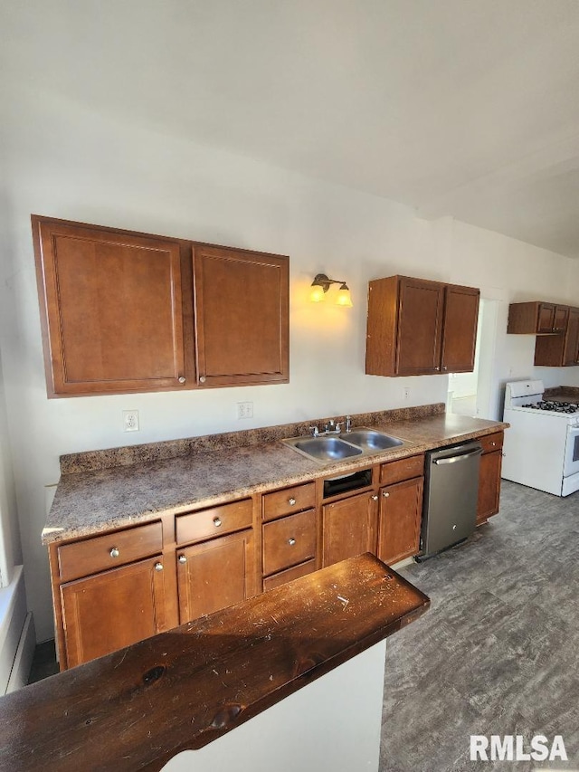 kitchen with dishwasher, white range with gas stovetop, sink, and dark carpet