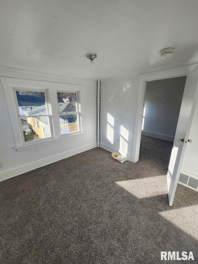 empty room featuring carpet flooring