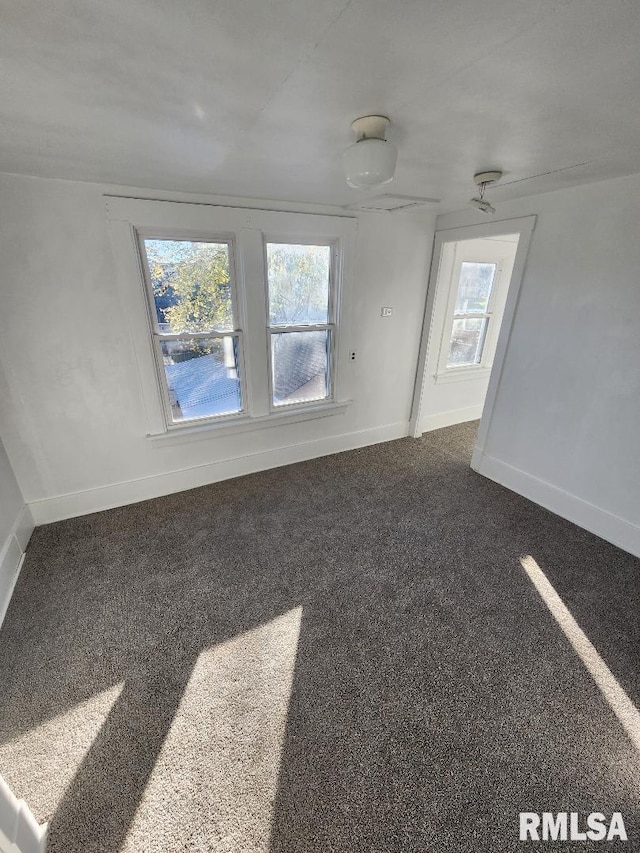 carpeted empty room with plenty of natural light