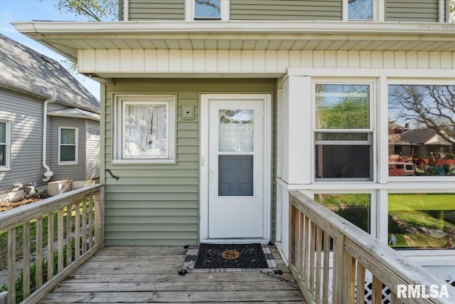 property entrance with a deck