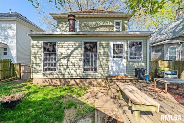 rear view of house featuring a deck