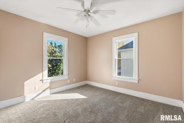 spare room with carpet floors and ceiling fan