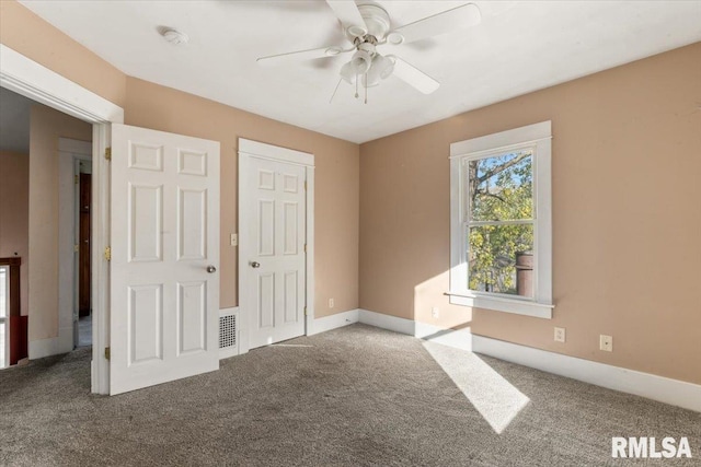 unfurnished bedroom featuring carpet flooring and ceiling fan