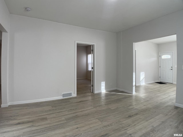 spare room featuring light hardwood / wood-style floors