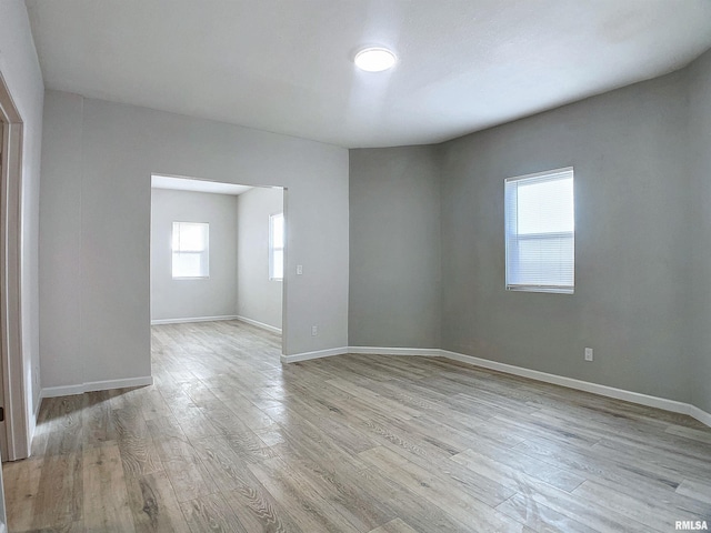 spare room featuring light wood-type flooring