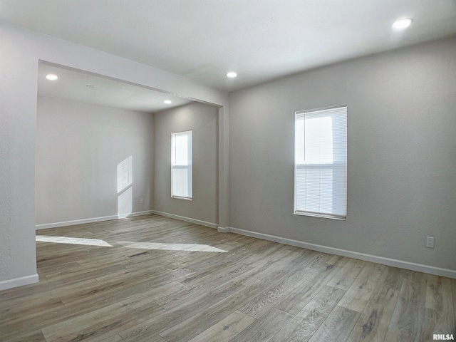 spare room with light wood-type flooring