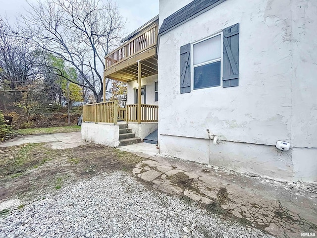 view of side of property with a deck