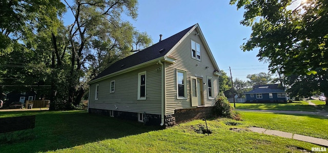 view of home's exterior with a lawn