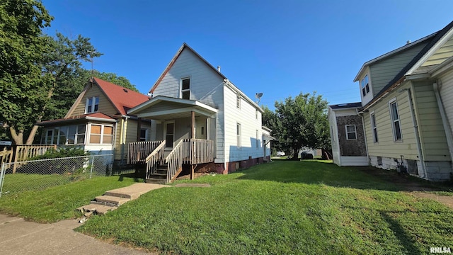 bungalow with a porch and a front lawn